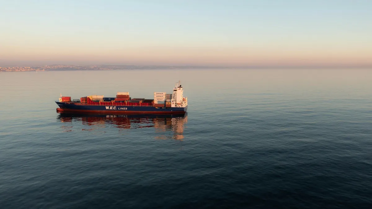 Container ship at anchor on a calm sea